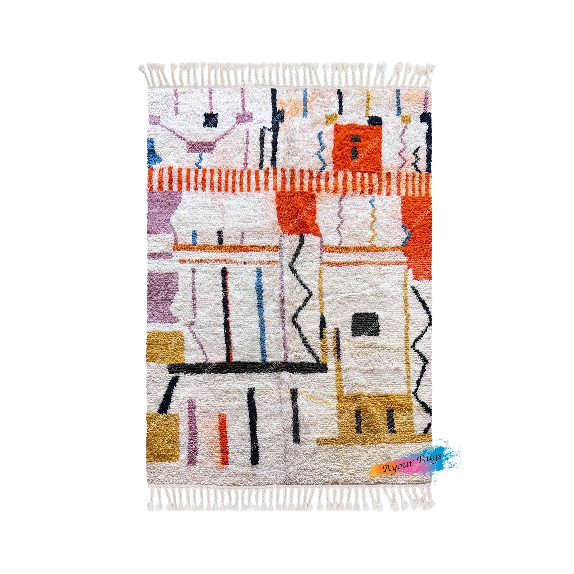 a colorful, abstract rug with various geometric shapes and patterns in shades of orange, white, and purple.