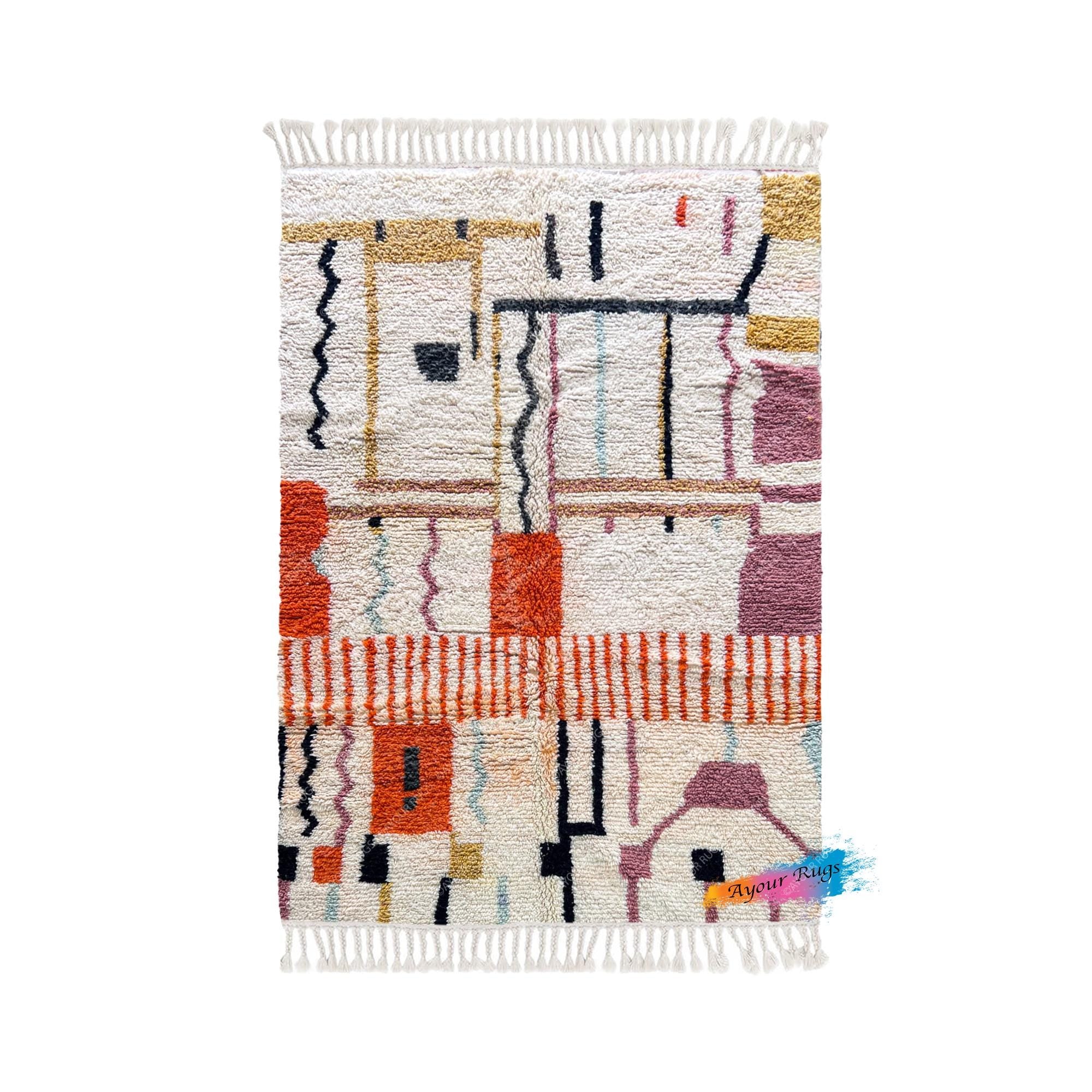 a colorful, abstract rug with various geometric shapes and patterns in shades of orange, pink, white, and black.